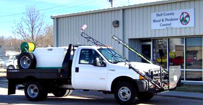 hall county weed control truck in front of weed control building